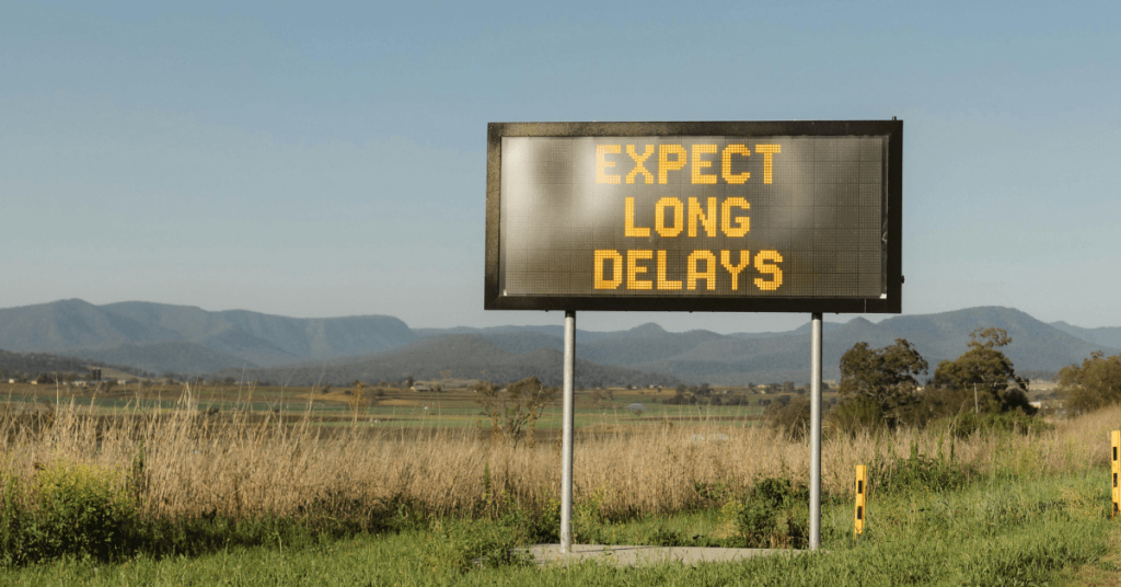 Expect long delays sign