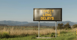 Expect long delays sign